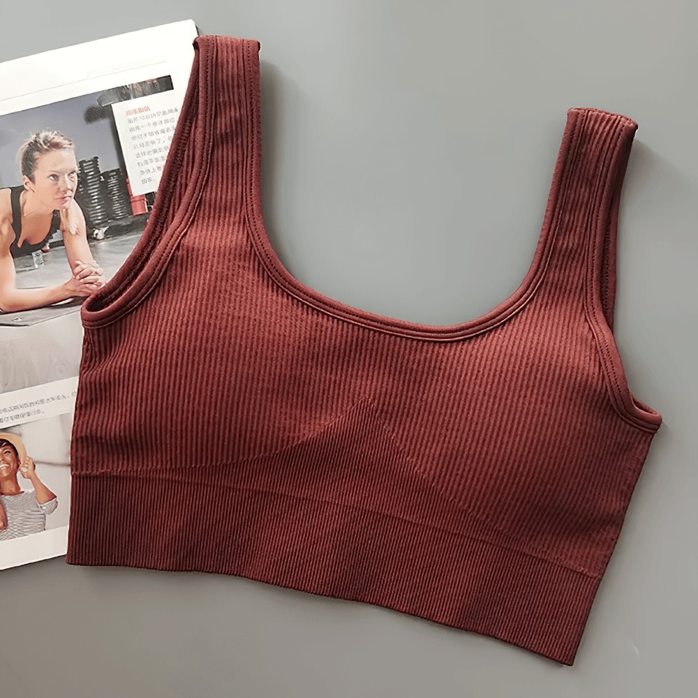 Seamless Ribbed Sports Bra for Women in maroon, made with breathable nylon and spandex. Perfect for yoga, pilates, or running.